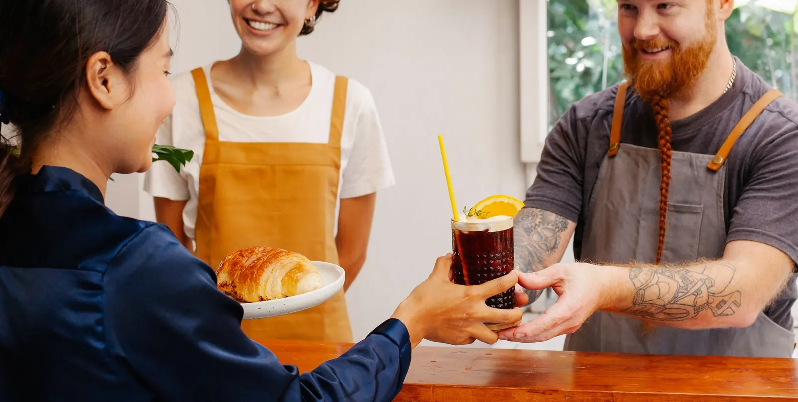 Staff serving a customer at the counter