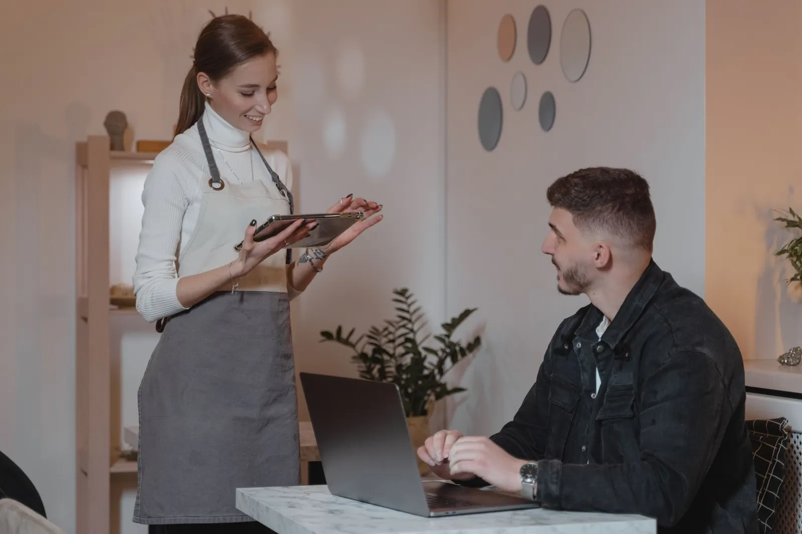 Server taking an order on a tablet